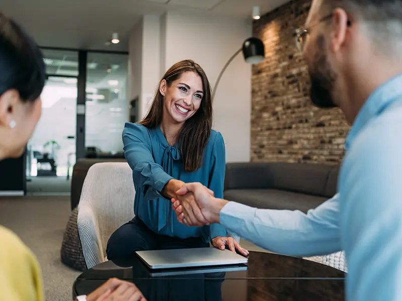 woman shaking bankers hand